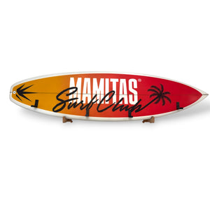 Real yellow, orange and red surfboard wall rack with Surf Club graphics, palm tree design and black coat and towel hooks.